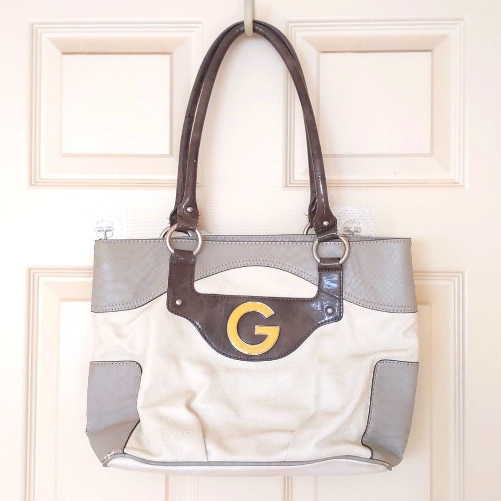 Guess Multi color zip shoulder bag.